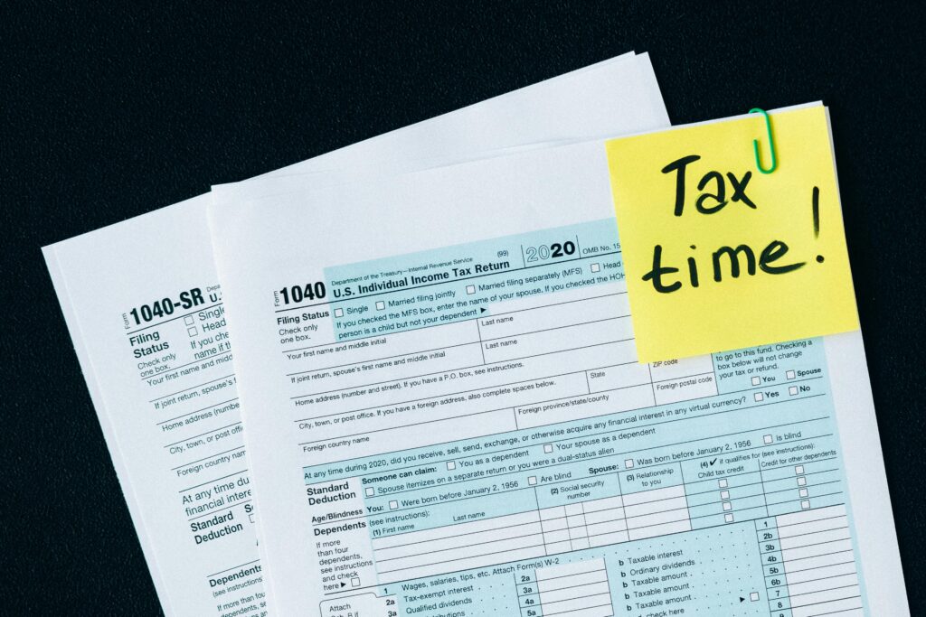 U.S. tax documents with a 'Tax time!' reminder, highlighting the importance of filing deadlines.